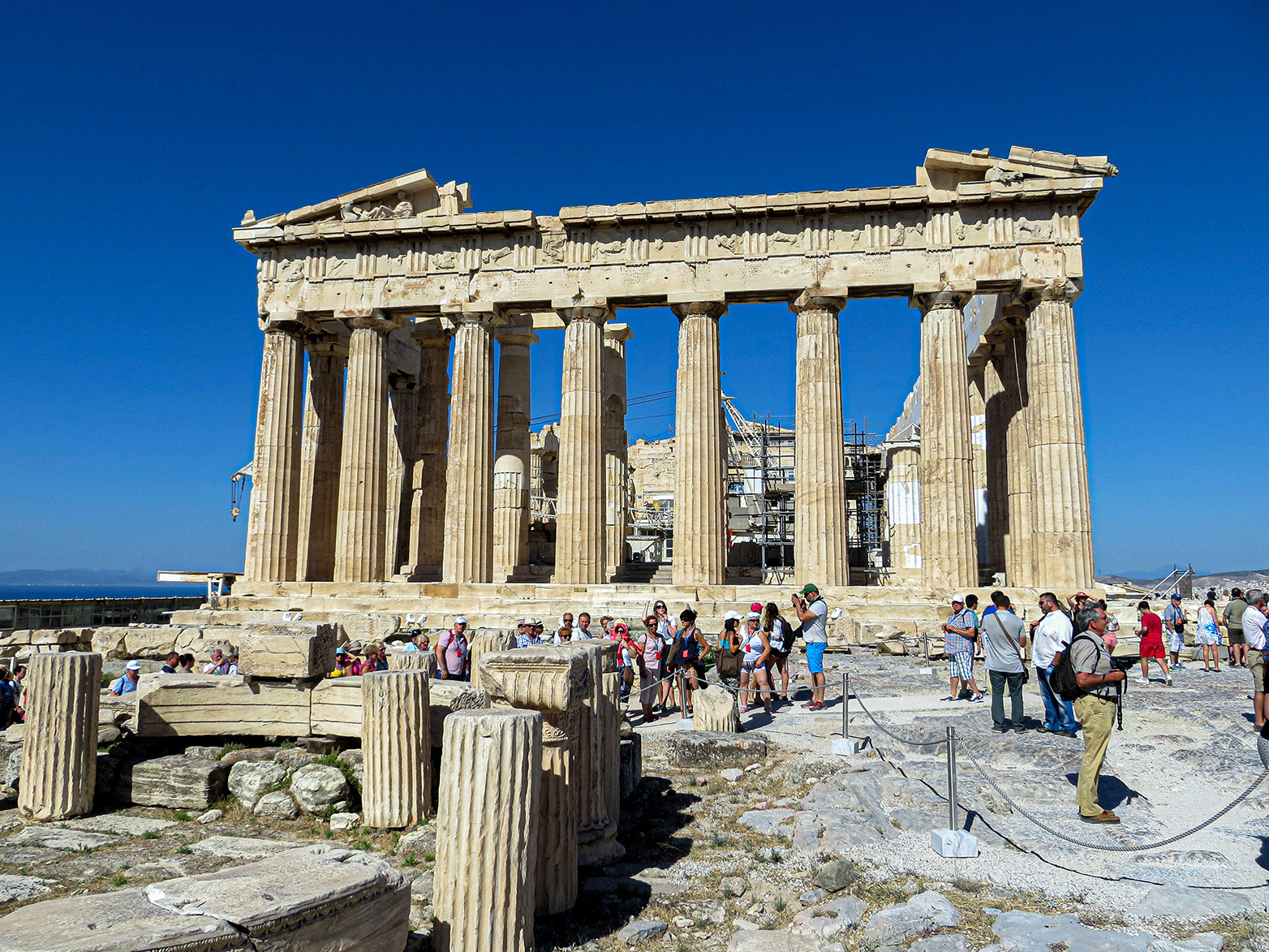 East facade of the temple with eight tall, fluted columns in the Doric style, architrave, frieze and cornice.